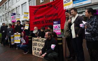 Lecturers gather outside Penhryn Road to protest against pay cuts