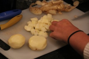 First step - chopping potatoes. Picture: Diogo Correia