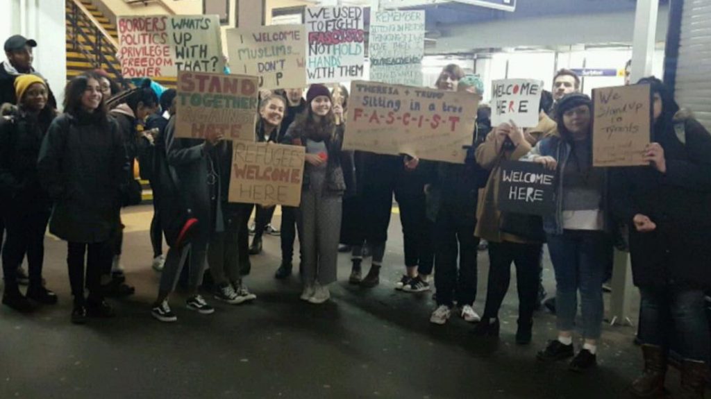 KU Students getting ready to protest the Muslim Ban at Downing Street. Photo credit: Elcin Kaya