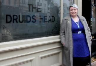 Sara Ann Hope standing next to one of her favourite pubs. 