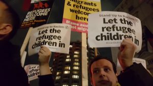 Protesters held placards welcoming refugees.