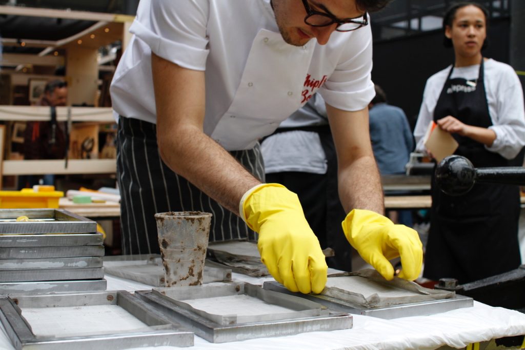 Nicoll preparing a sheet of Chip[s] Board 