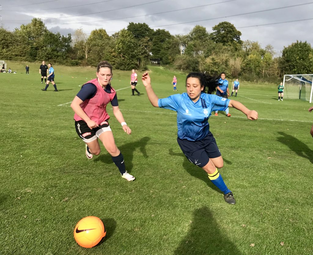 Kingston’s Diana Marcela (right) scored the first goal for the Cougars. 