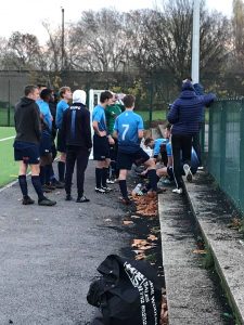 The Kingston team discussing tactics with Coach, Besim Ali at the end of regular time. Credit: Craig House