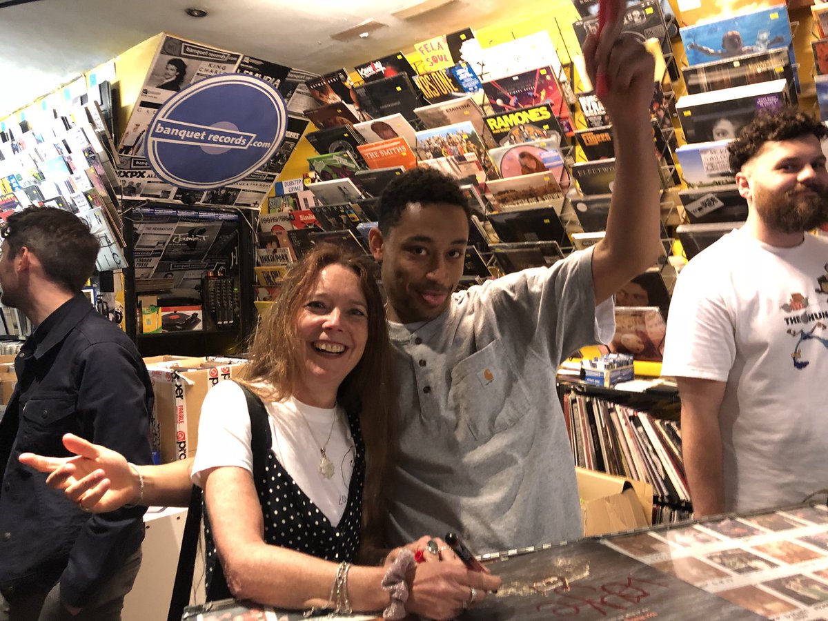 Two people pictured in a Kingston record store.