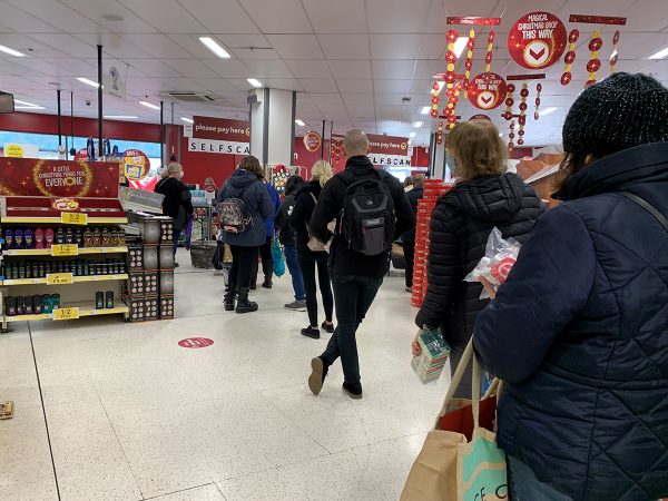 People are lining up to purchase their goods in Wilko