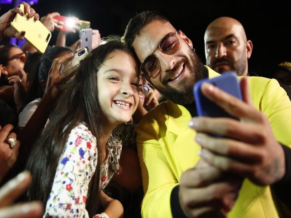 Maluma taking a selfie with a fan