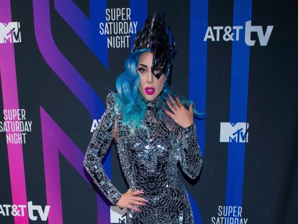 Lady Gaga posing at the photo-call wearing a crystallised dress