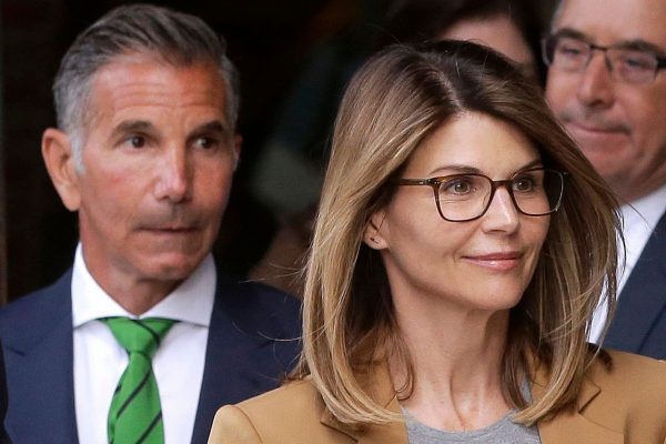 Actress Lori Loughlin, front, and her husband, clothing designer Mossimo Giannulli, part of the 2019's college admission scandal in the US