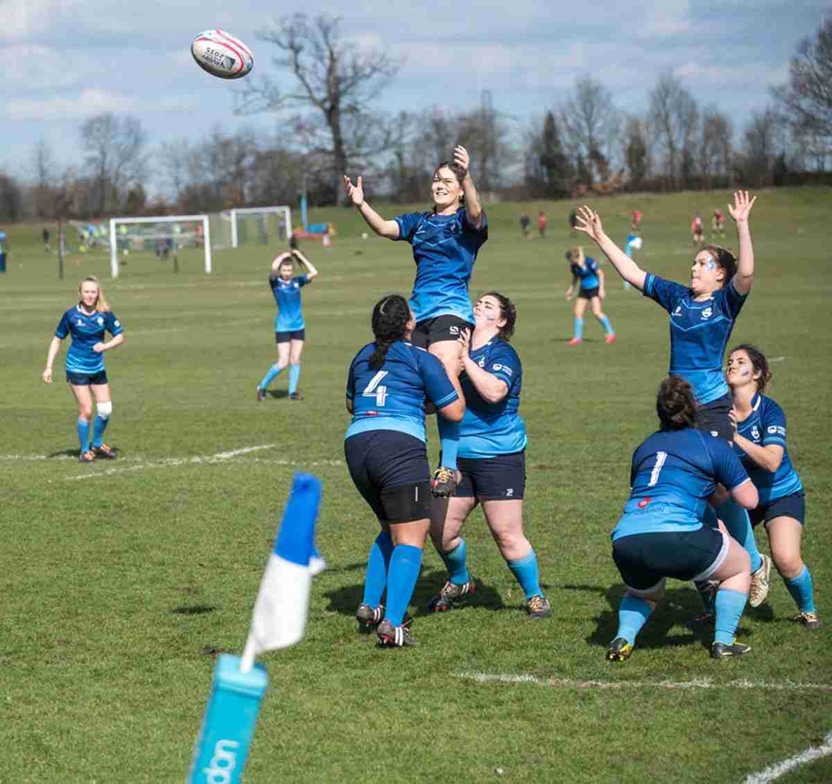 KU women's rugby perming a line-out