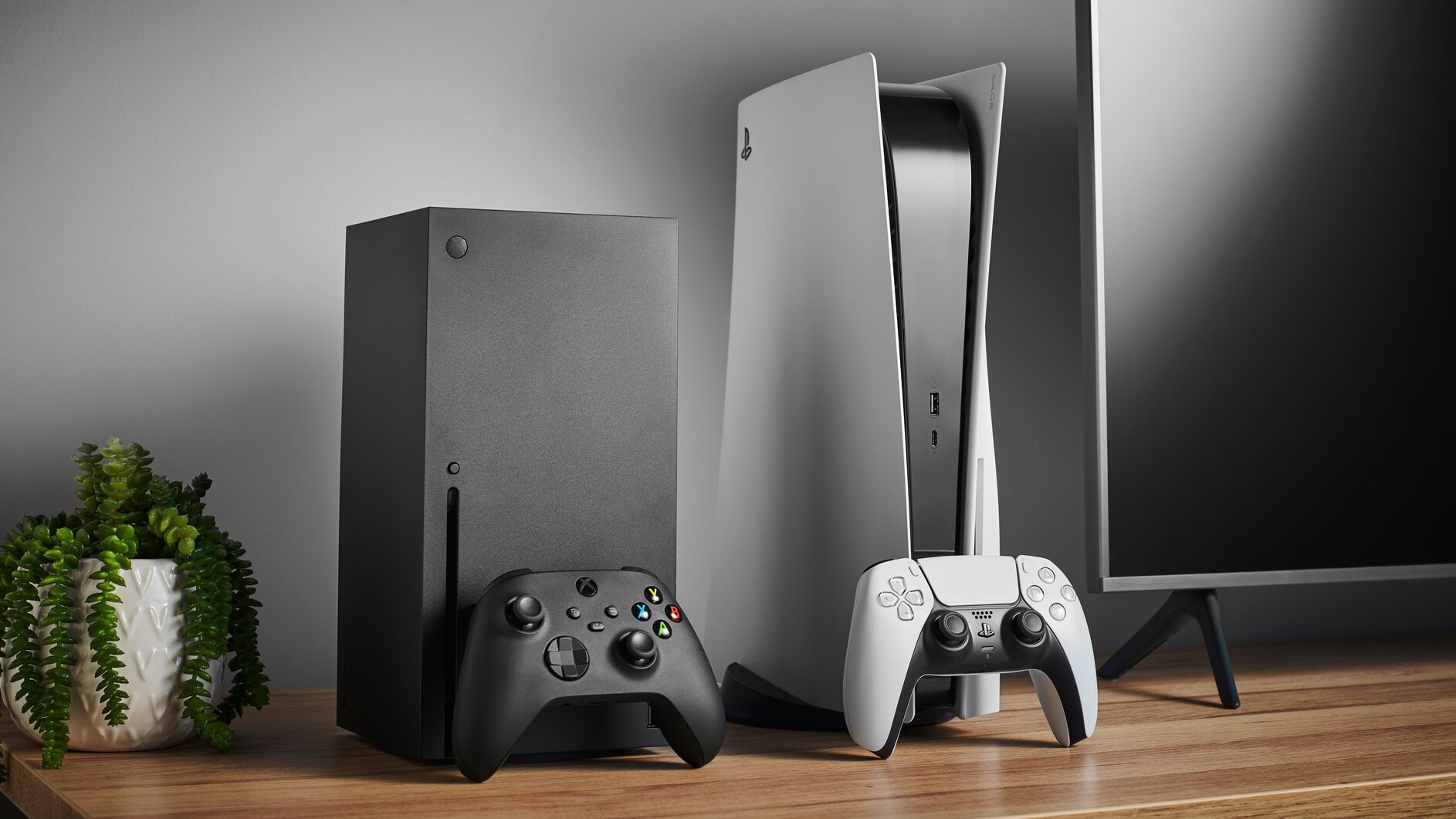 An image of both the Xbox Series X and PS5 on a home shelf