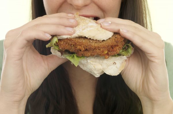 Woman eating a burger