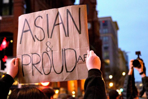 "Asian and proud" banner shown at a rally in solidarity with the recent Anti-Asian incidents in the US