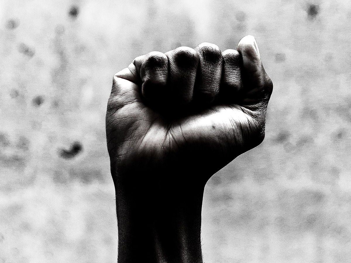 Black and white photo of a raised fist.