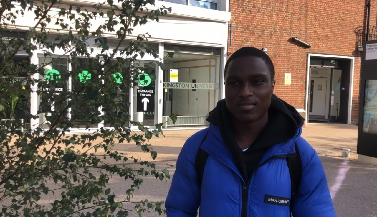 Person standing in front of Kingston University
