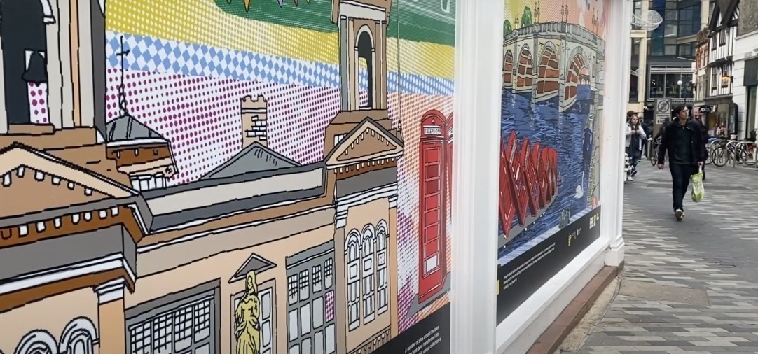 Shop window with illustrations of Kingston Town centre.