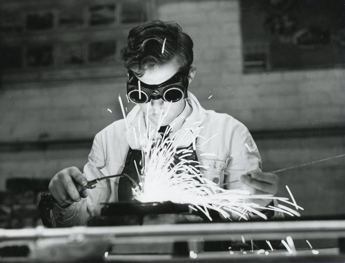 student wearing goggles is gas welding