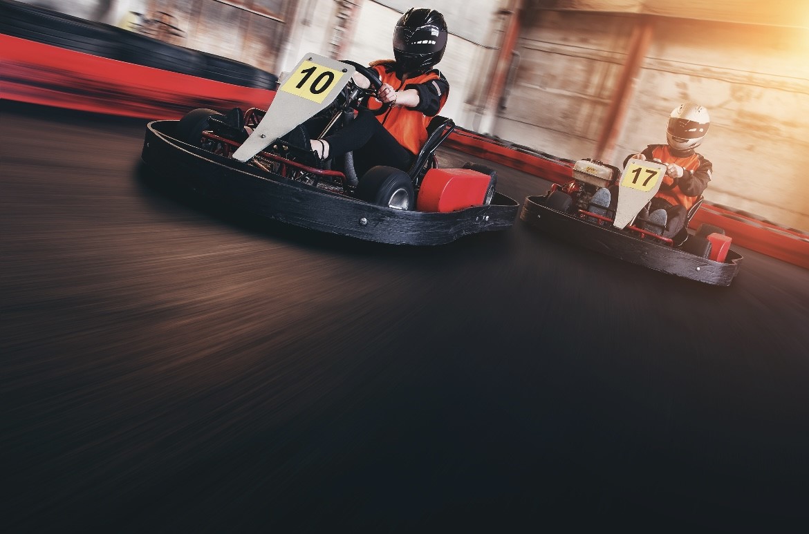 Two go-karts racing against each other. 
