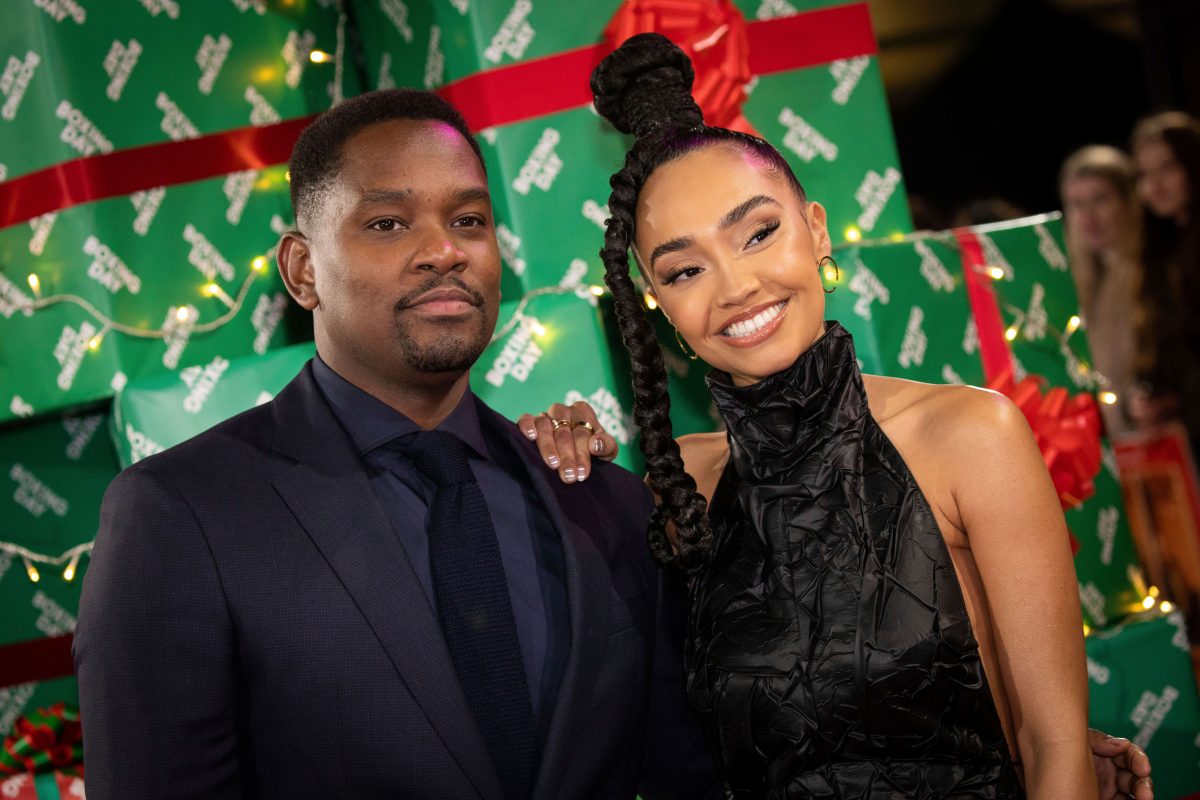 Aml Ameen and Leigh-Anne Pinnock smiling at film premiere