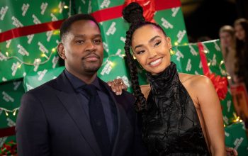Aml Ameen and Leigh-Anne Pinnock smiling at film premiere
