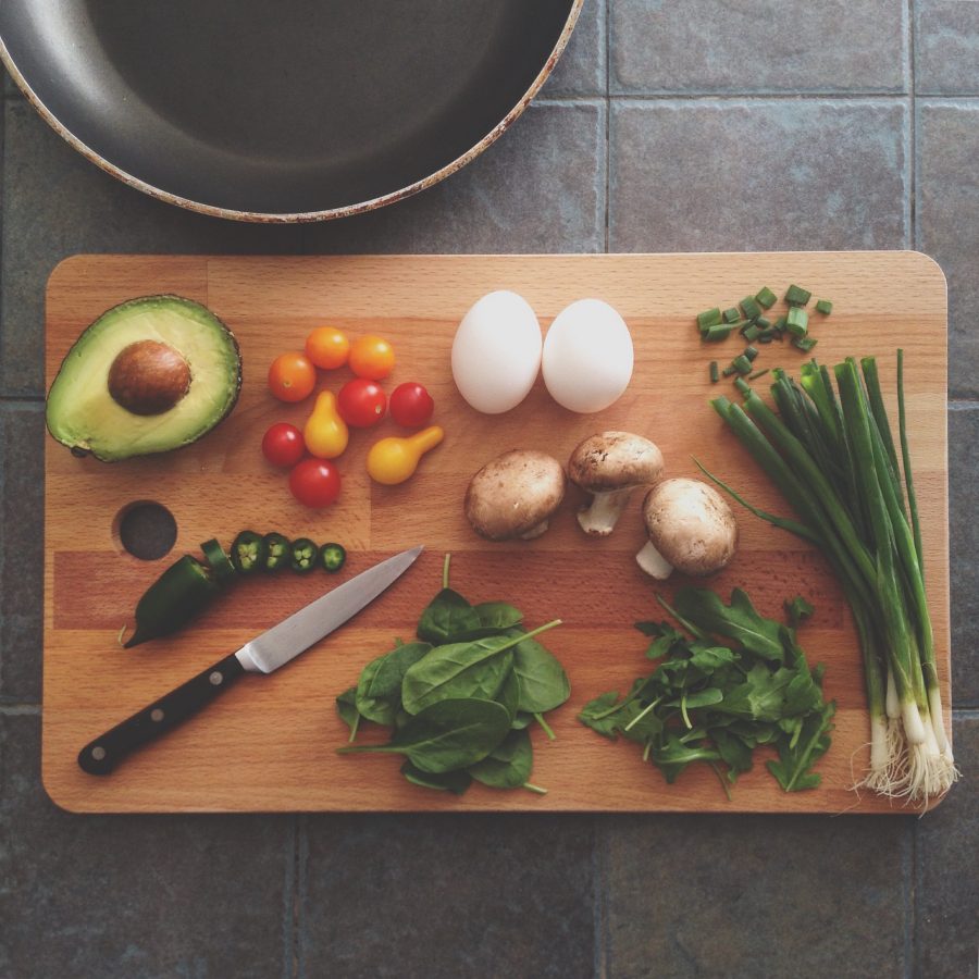 Chopping board with vegetables on