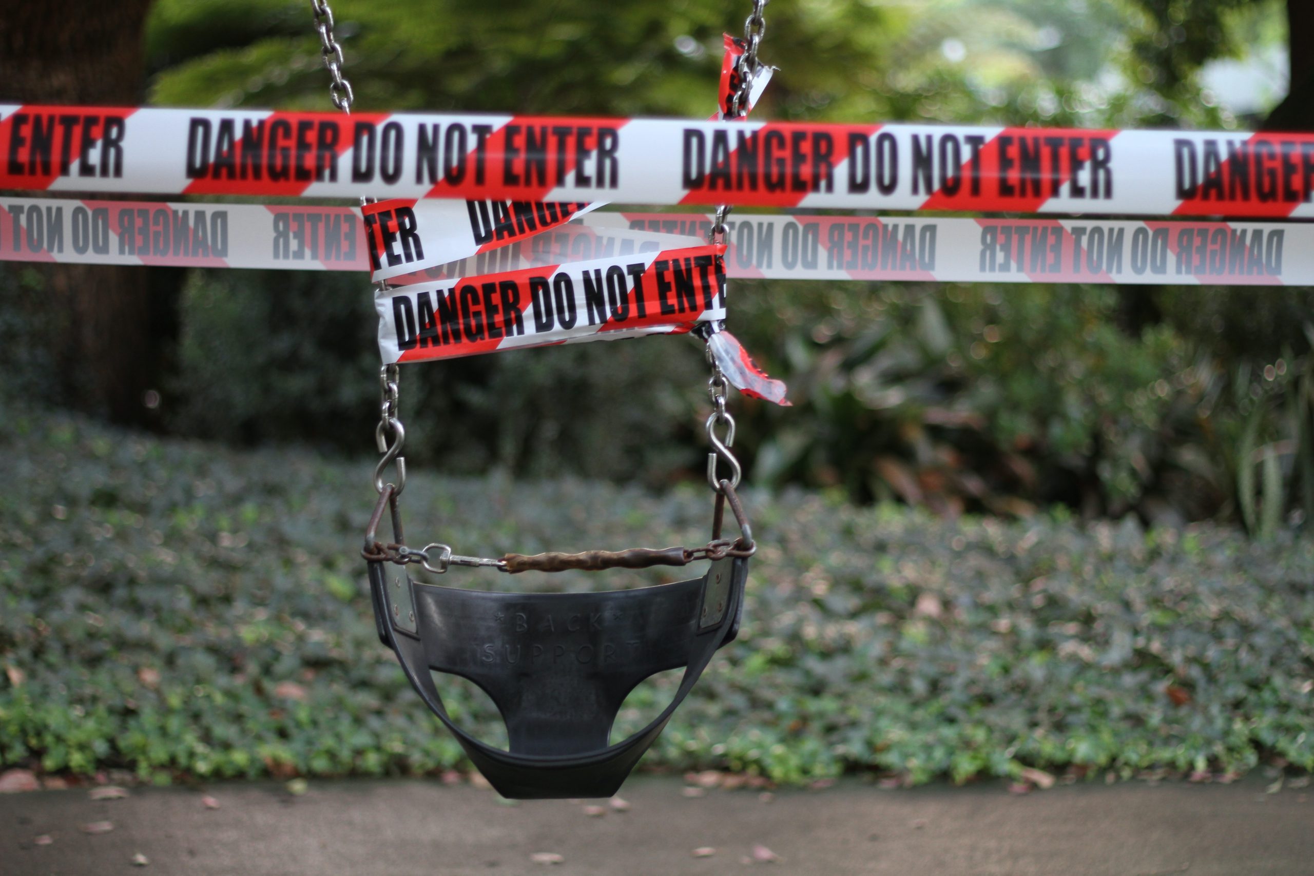 a swing wrapped in police tape