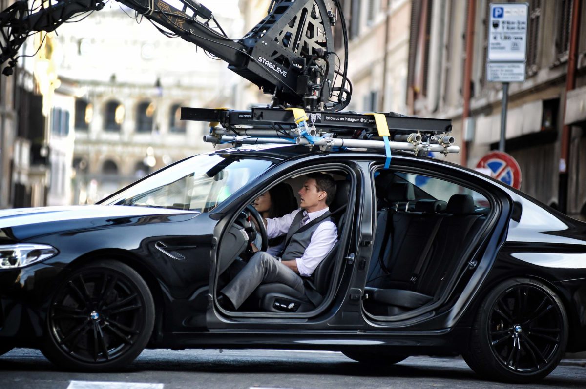 Tom Cruise in a car on the set of Mission Impossible 7