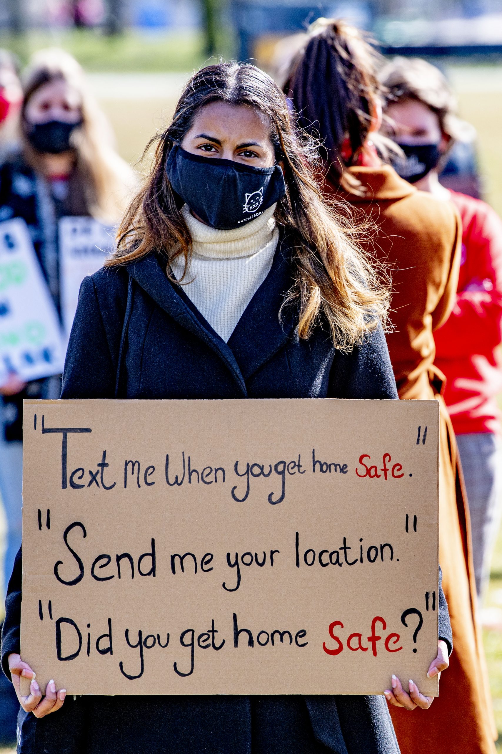 Protest sign reading texts about getting home safe