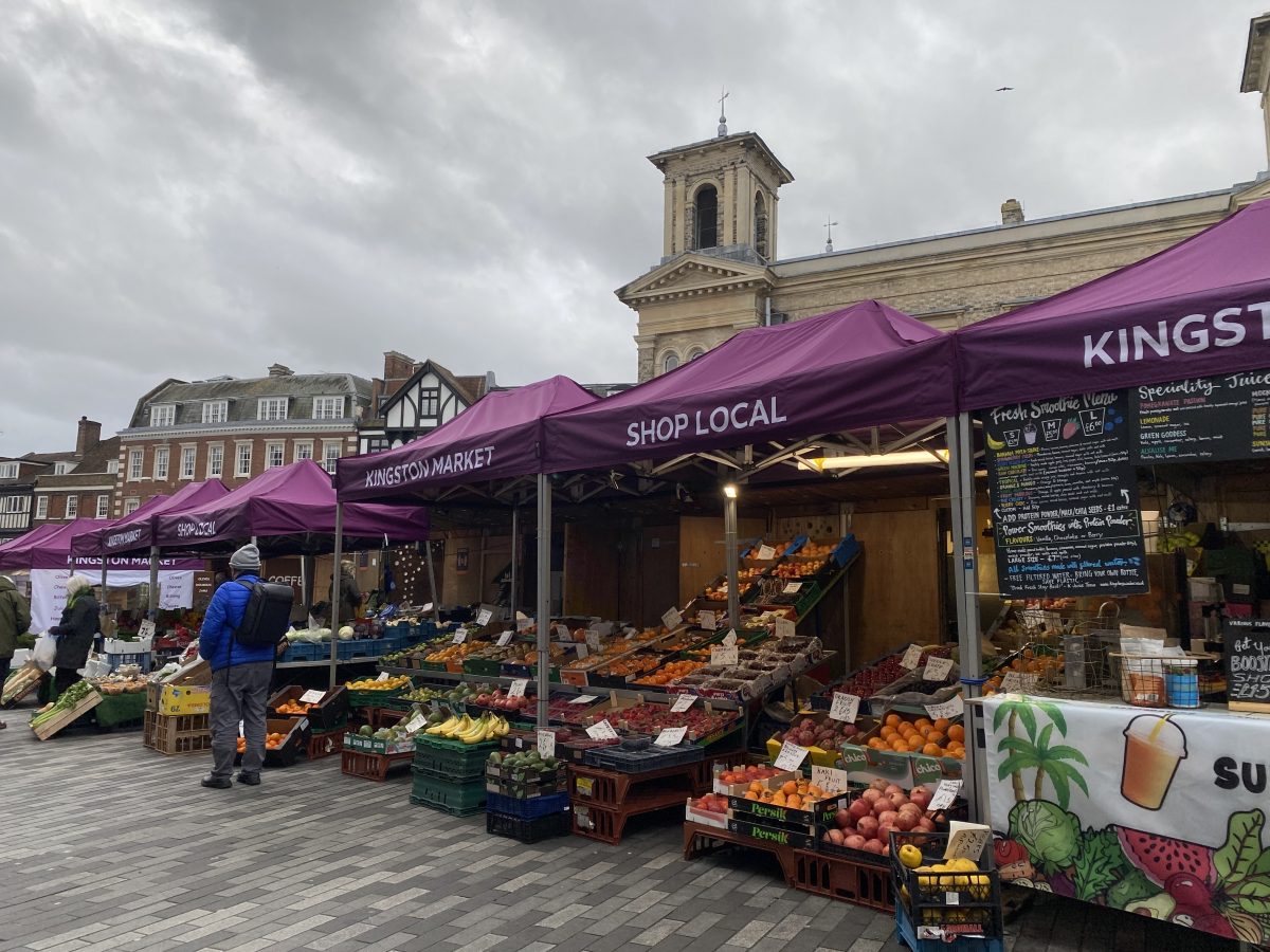 Market stalls with vegetables on display.