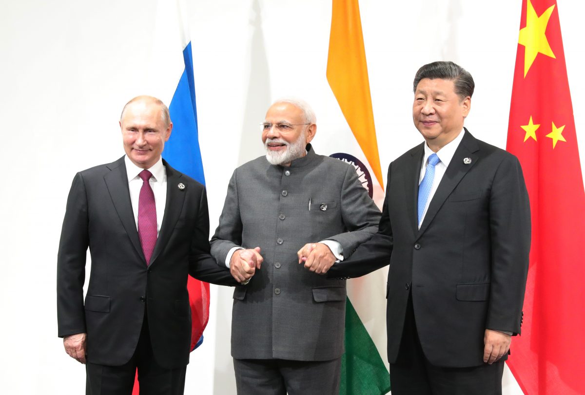 Vladimir Putin, Narenda Modi and Xi Jinping holding hands