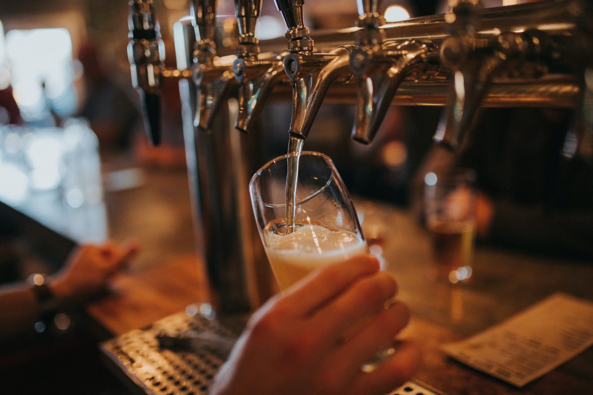 Person pulling a pint