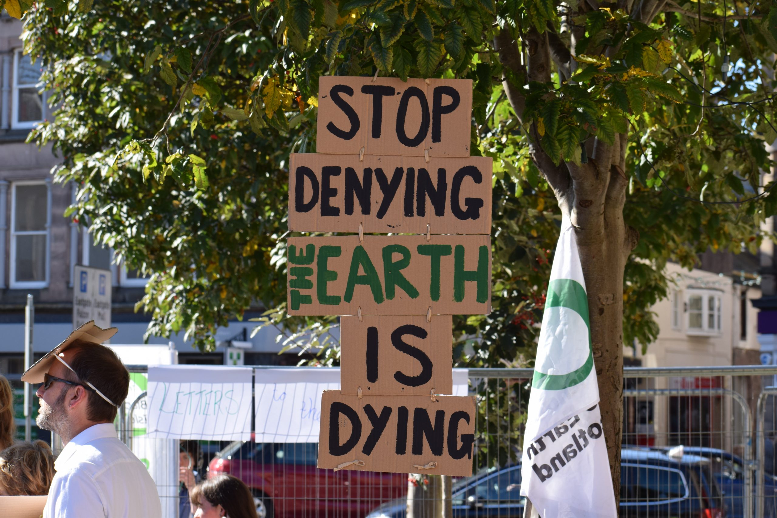 'Stop denying the Earth is dying' sign
