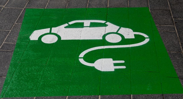 electric car charging parking space on the ground. 
