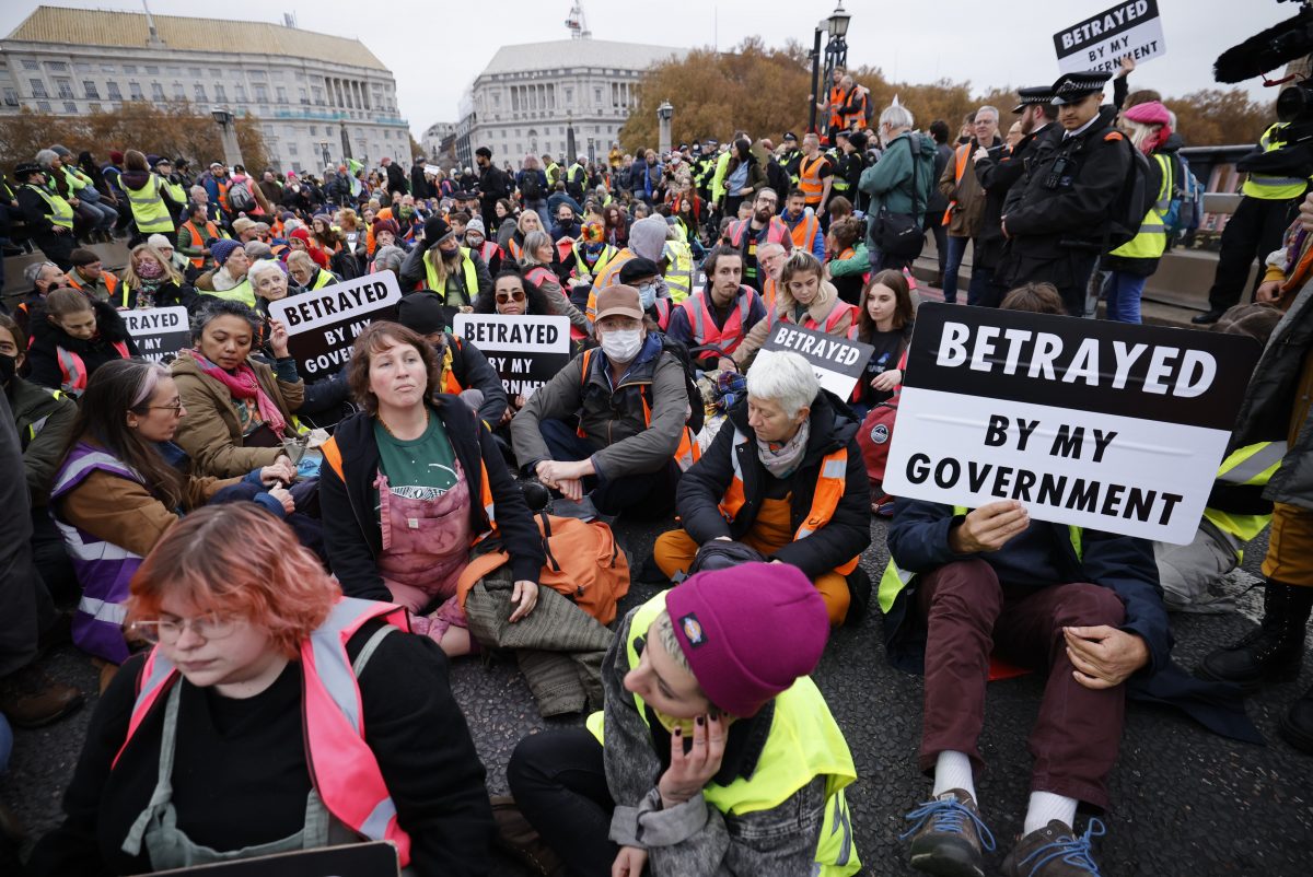 climate protestors sitting on the floor