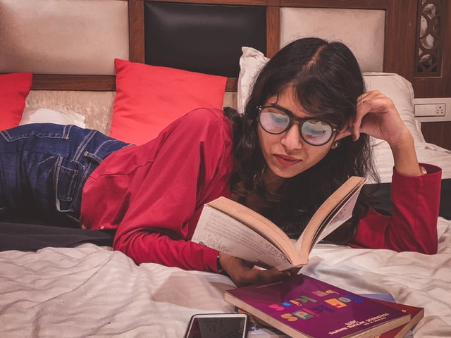 woman reading in bed