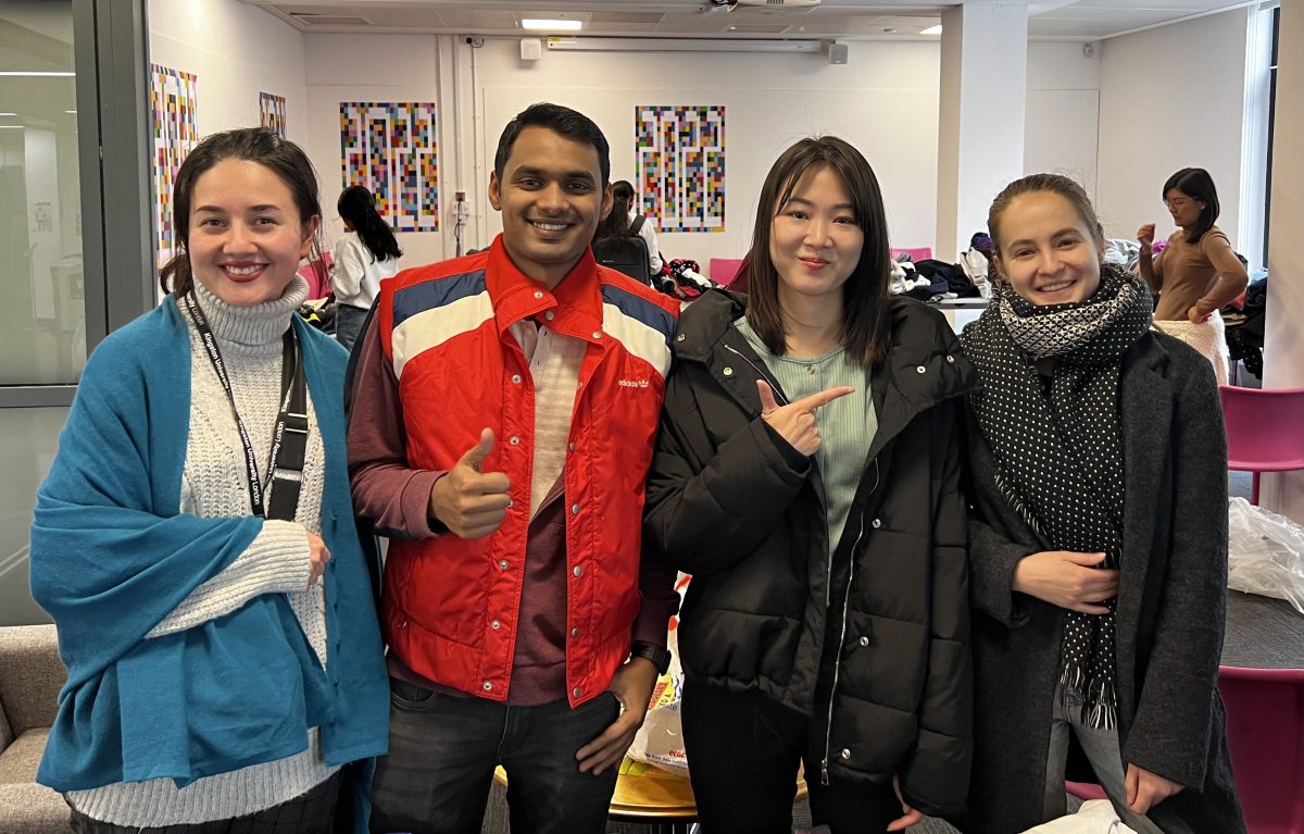 Students pose in their new coats