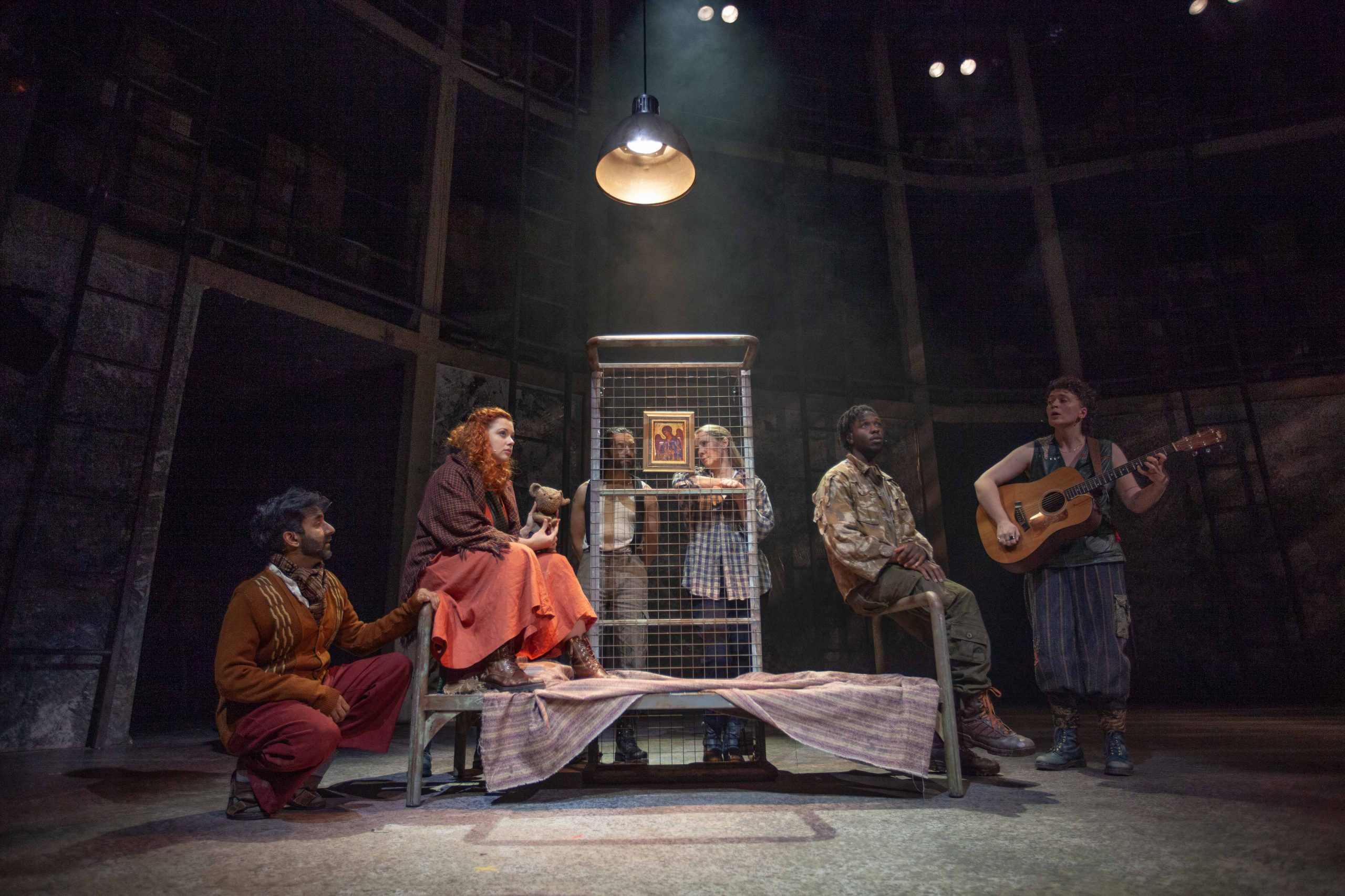 Cast of The Caucasian Chalk Circle on stage during a scene