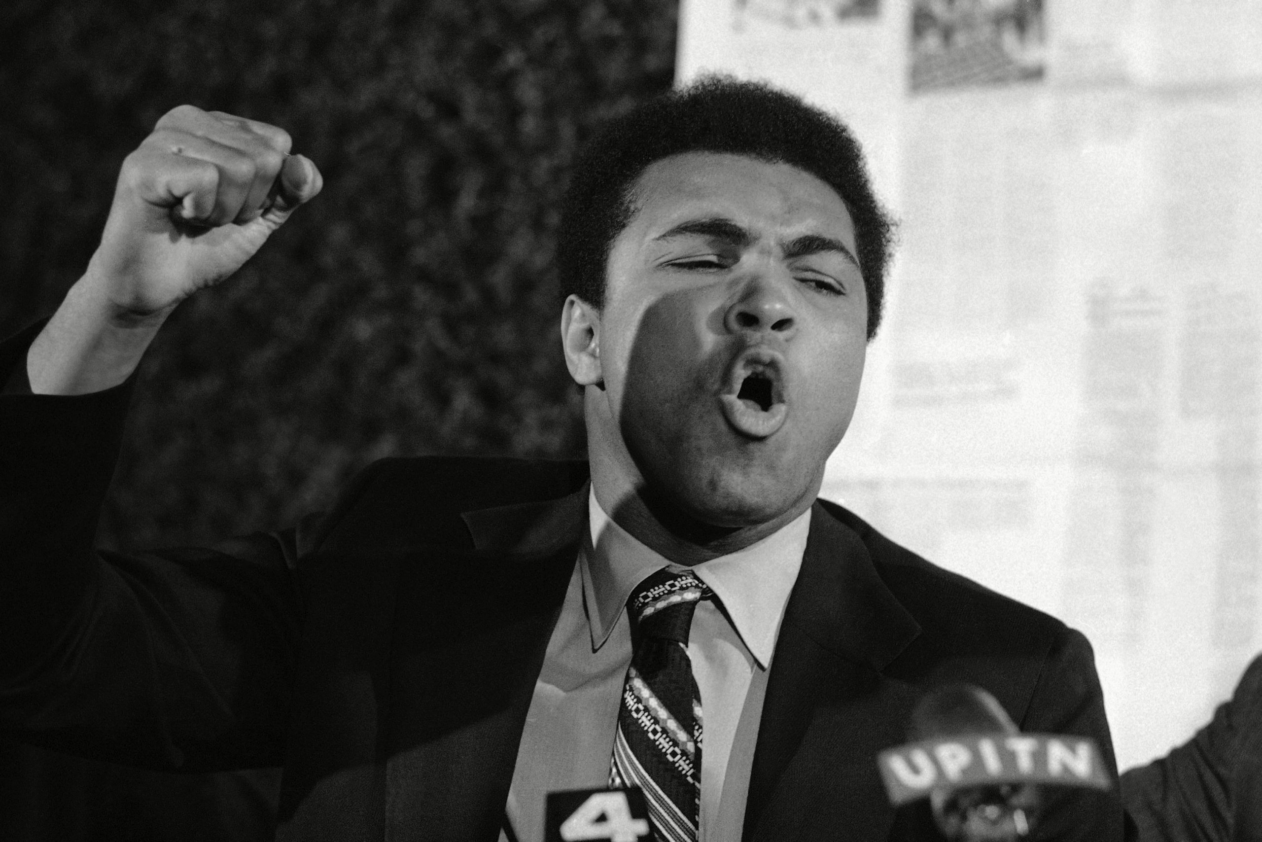Muhammad Ali speaking at a news conference
