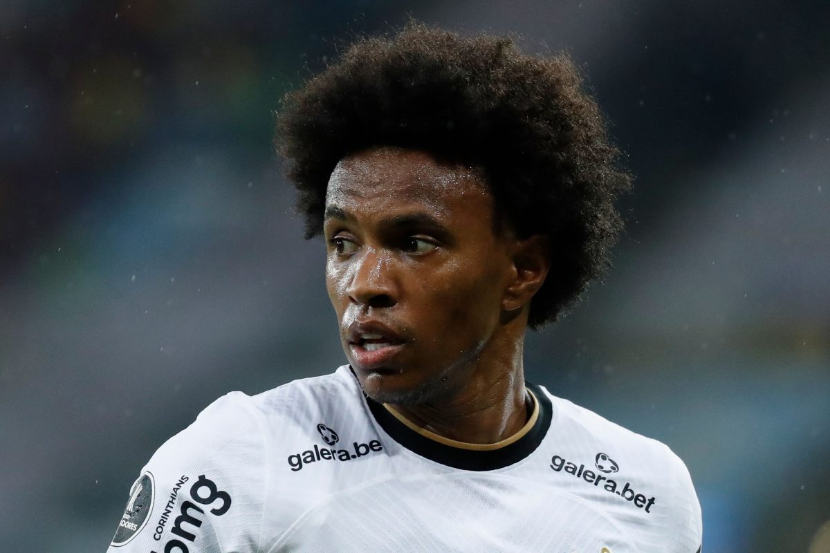 Close up shot of Willian wearing a Fulham FC white jersey. 