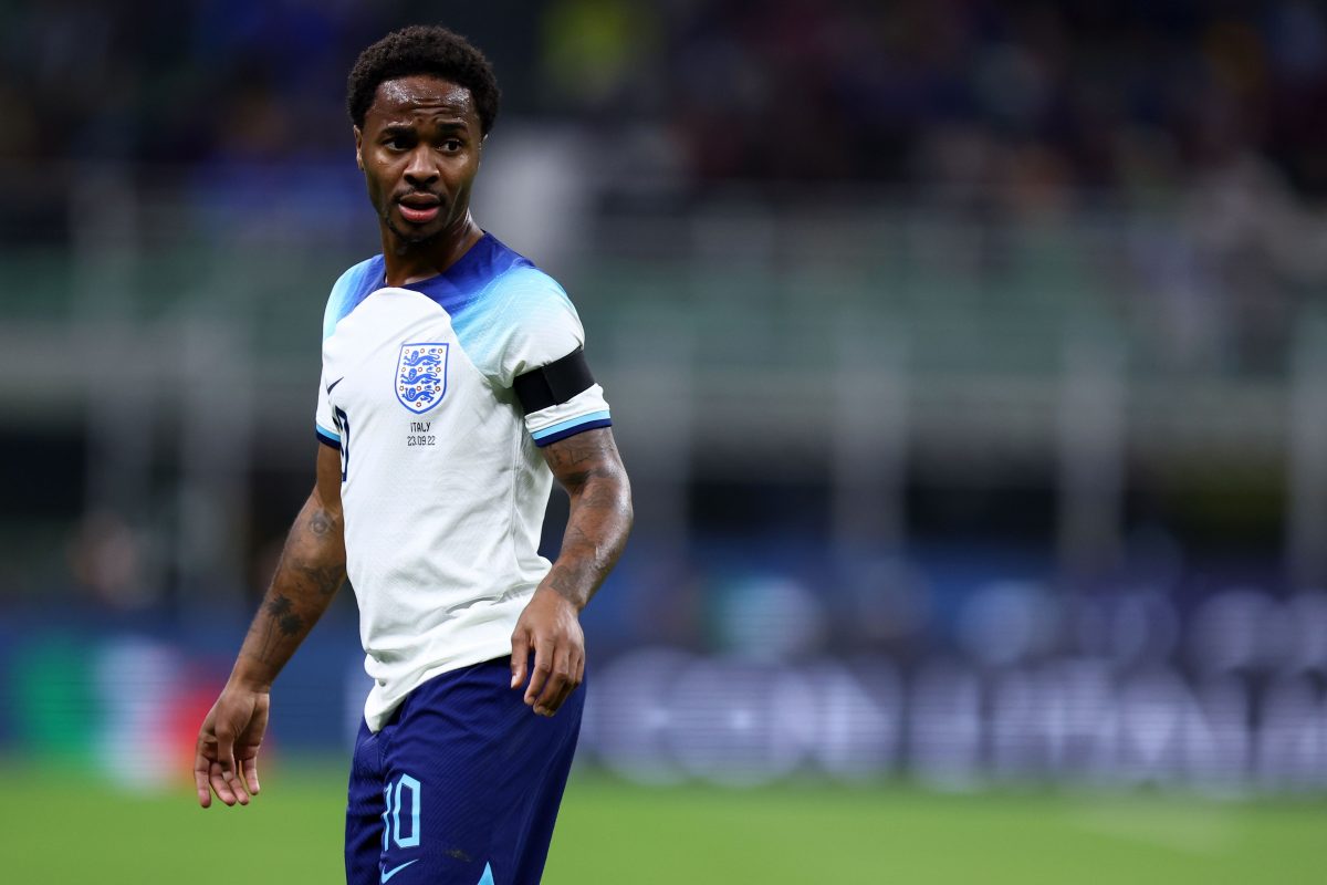 Sterling wearing the white and two tone blue England uniform.