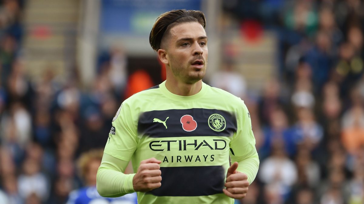 Jack Grealish with the green and black Man City uniform.