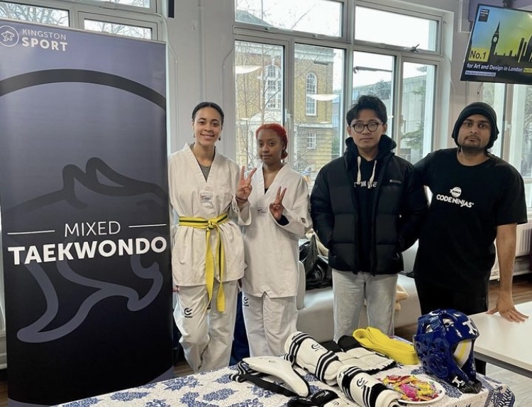 Students at the Taekwondo stand at the refreshers fair