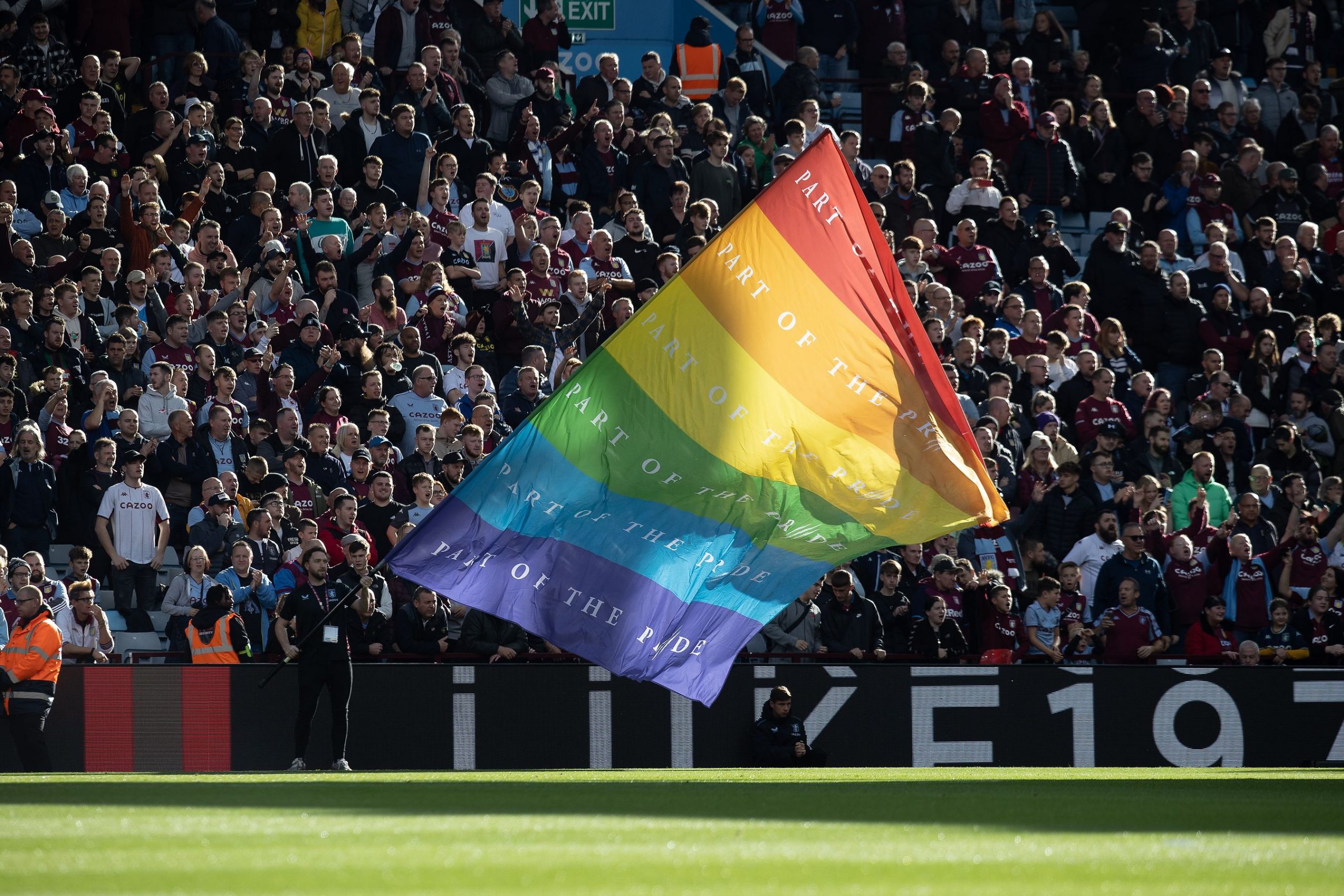 Pride flag being waved in stadium