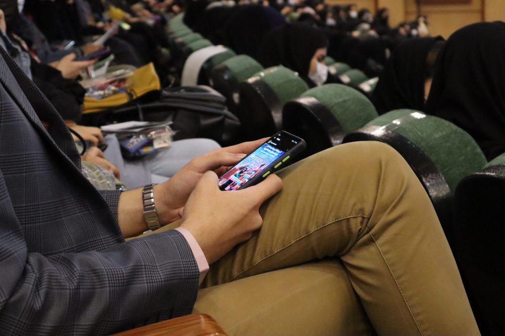 Student on their phone in a university class