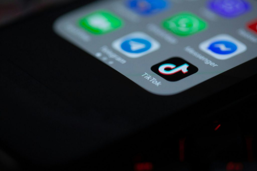 The picture shows the corner of the iPhone screen showing apps such as tiktok  